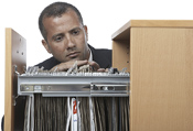 manlookingatfiles32146472.jpg